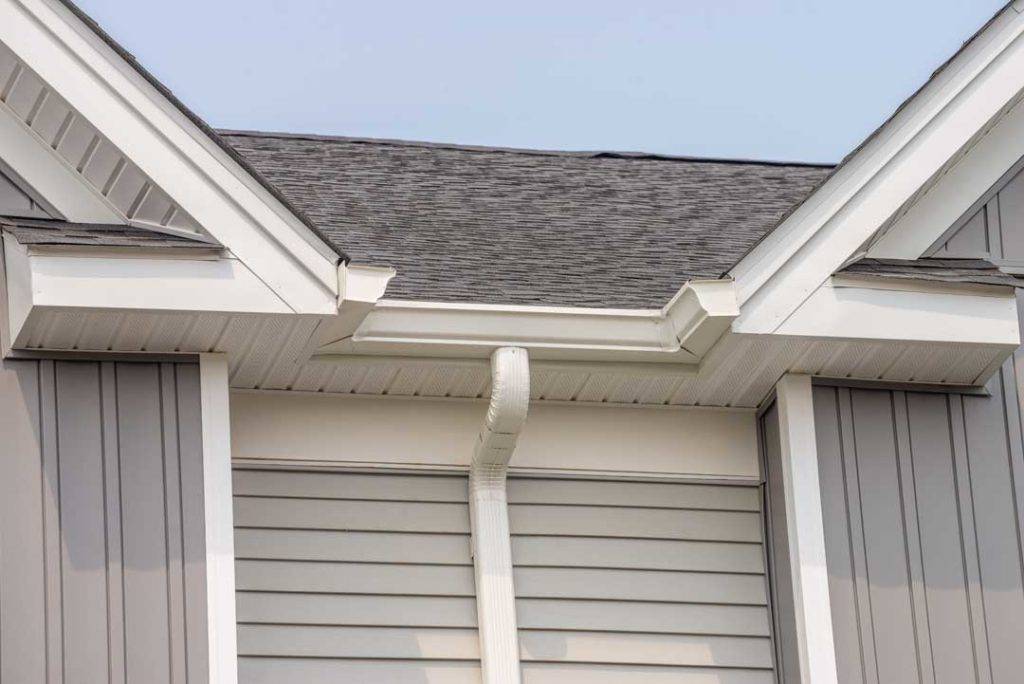 Gutter With Downpipe On The Roof Of A House Metal Pipe